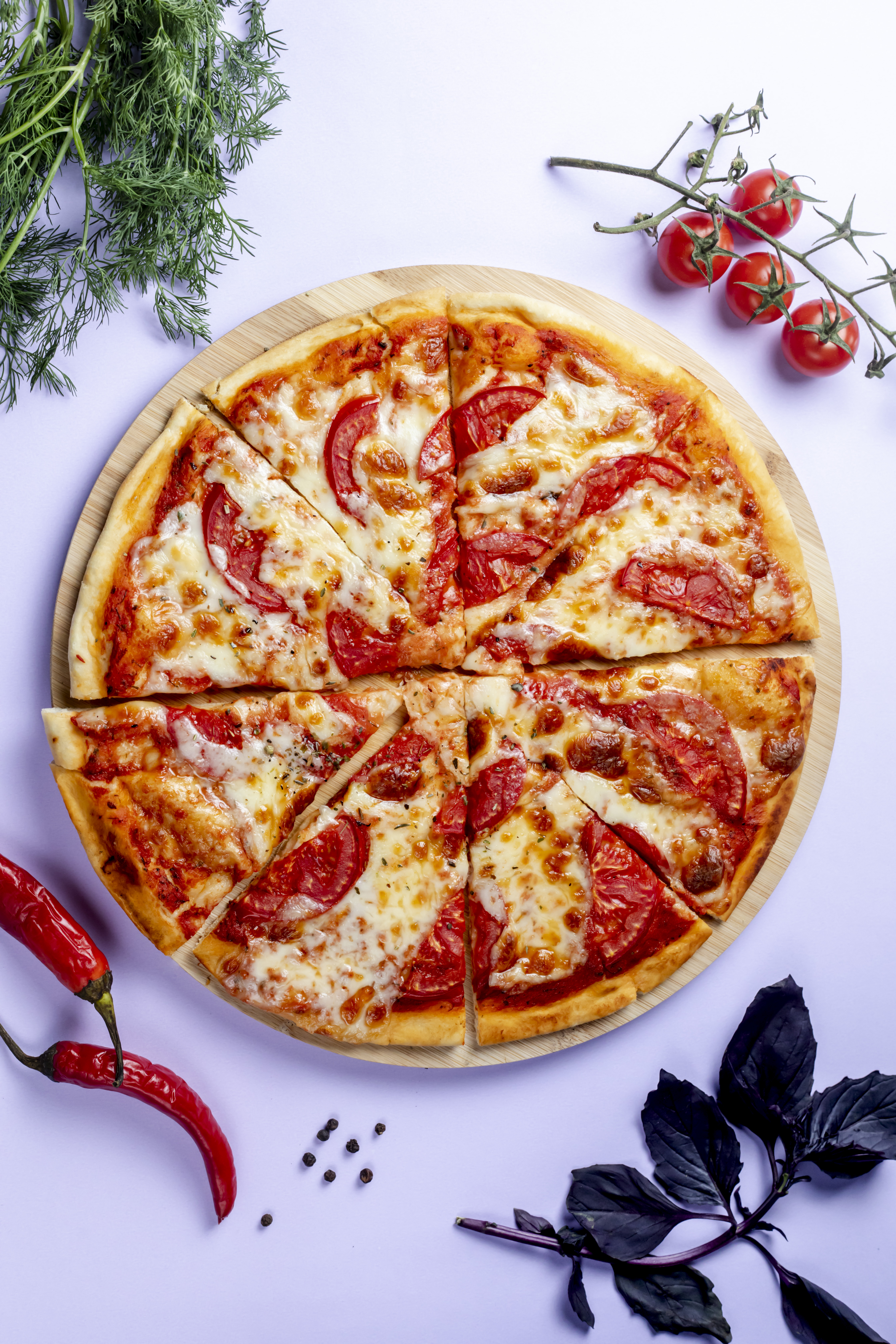 Hands stretching pizza dough