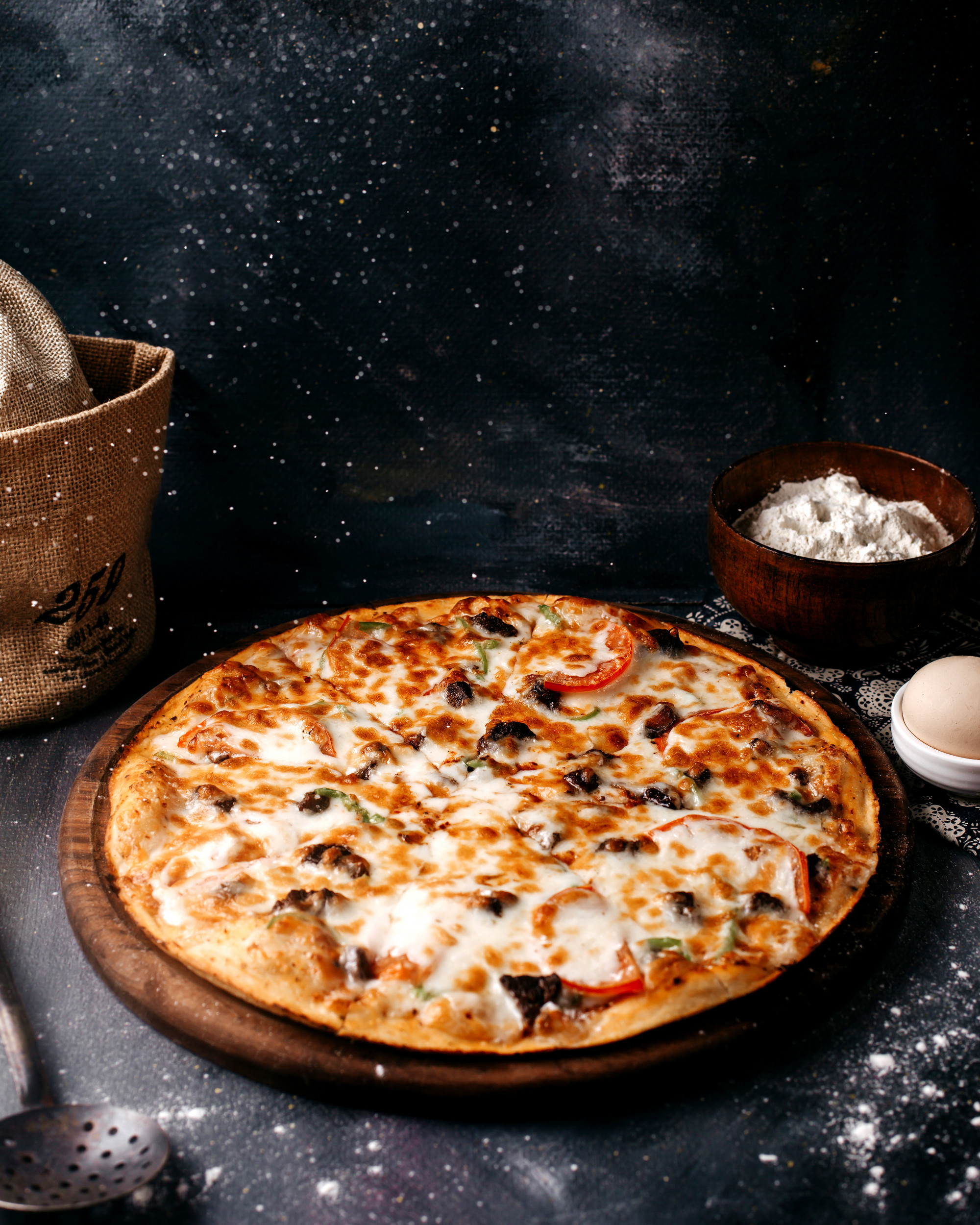 Placing toppings on pizza
