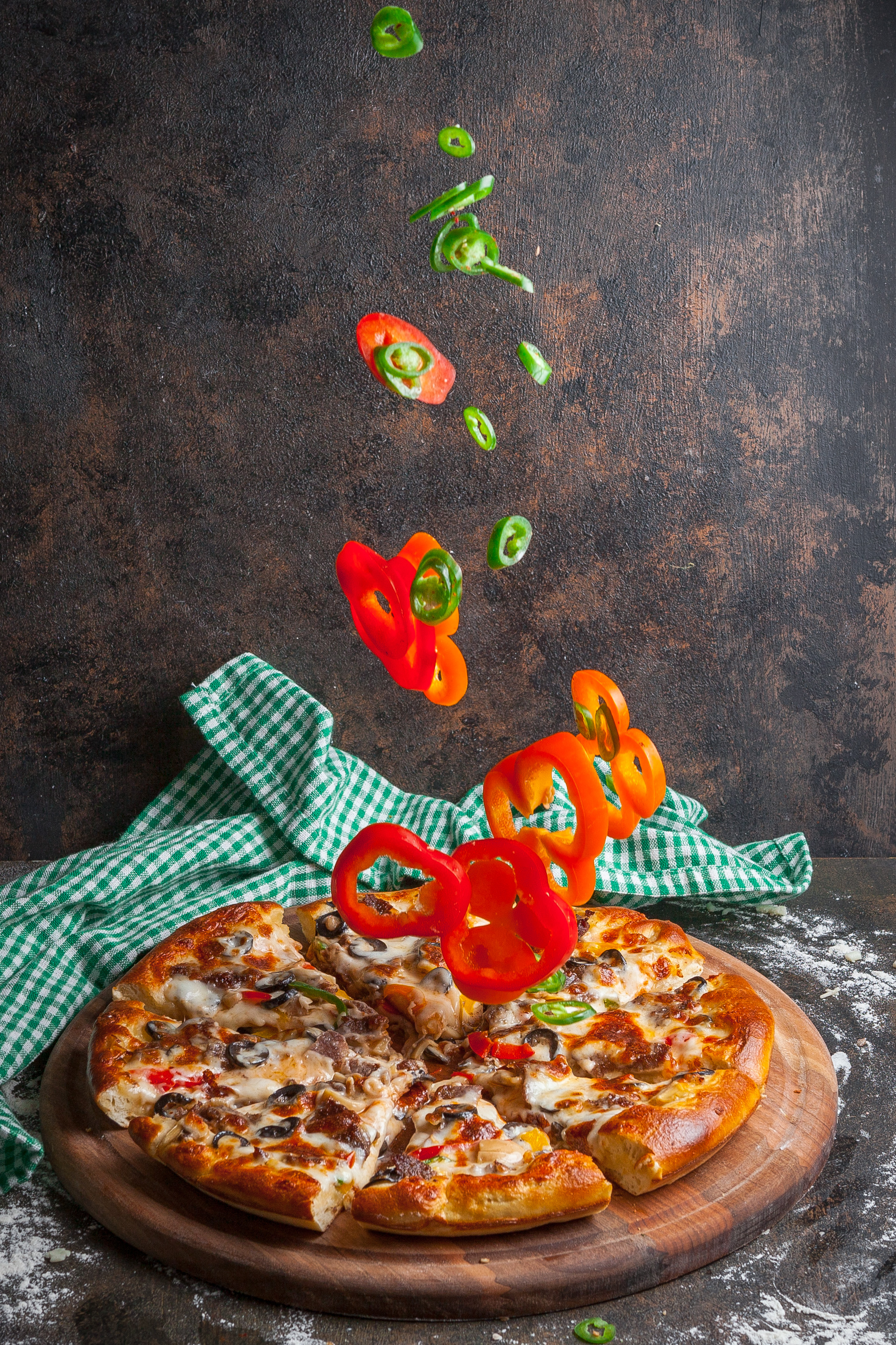 Chef holding pizza slice
